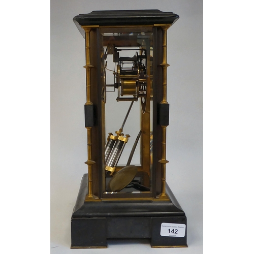 142 - A late Victorian four glass and black slate cased mantel clock with bevelled panels, integral, outse... 