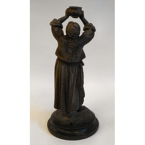 143 - A late 19thC spelter lamp base, a standing figure of a woman with plaits, holding aloft a bowl, on a... 