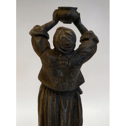 143 - A late 19thC spelter lamp base, a standing figure of a woman with plaits, holding aloft a bowl, on a... 