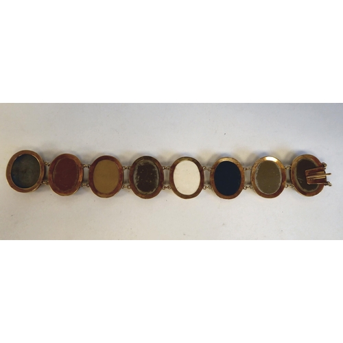 147 - An antique yellow metal mounted, intaglio bracelet, set in various colours with a series of eight ca... 