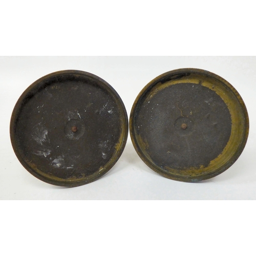 157 - A pair of mid Victorian taperstick holders, fashioned as cast and patinated female figures, each wea... 