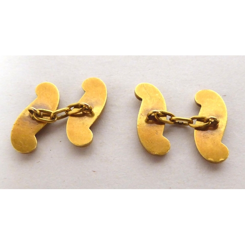 163 - A pair of yellow metal cufflinks