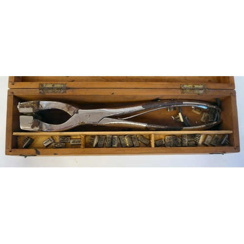 165 - A 1920/30s calves ear tattoo marker with an Arnold & Son, London scissor action implement, in a ... 