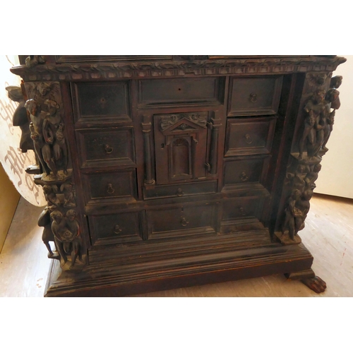 17 - A 17th/18thC Italian fruitwood and pine table/curiosity cabinet, the shelf top over a frieze drawer,... 