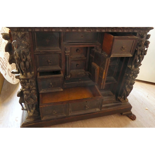 17 - A 17th/18thC Italian fruitwood and pine table/curiosity cabinet, the shelf top over a frieze drawer,... 