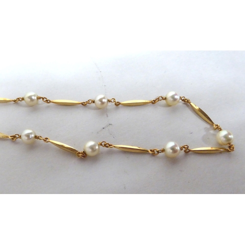 174 - A yellow metal bar link necklace, set with cultured pearls