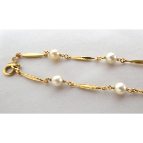 174 - A yellow metal bar link necklace, set with cultured pearls