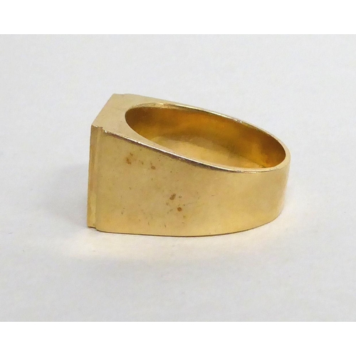 175 - A yellow metal signet ring