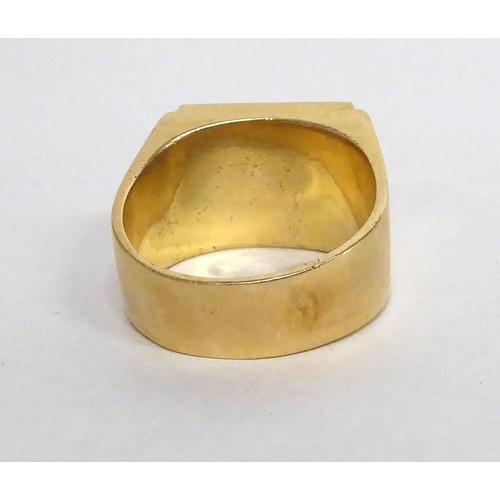 175 - A yellow metal signet ring