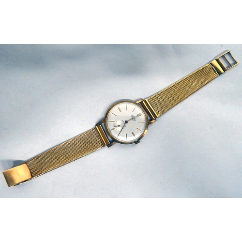 178 - A Trebex 18ct gold bracelet watch, the manual wind movement faced by a baton dial