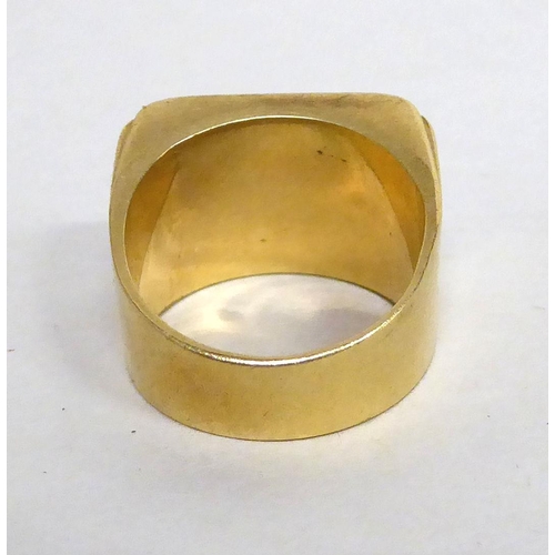 180 - A yellow metal seal design signet ring