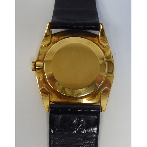 181 - A Patek Philippe 18ct gold cased Gubelin wristwatch, faced by a Roman dial, on a black hide strap&nb... 