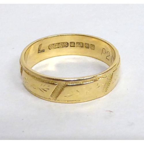 187 - An 18ct gold wedding band