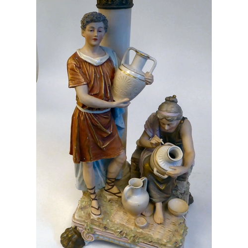 196 - A 20thC Royal Dux ceramic table lamp, fashioned as a Biblical group, depicting a young man and woman... 