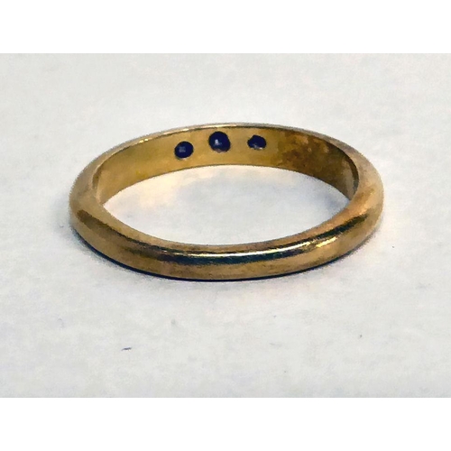 200 - An 18ct gold wedding band, set with three diamonds