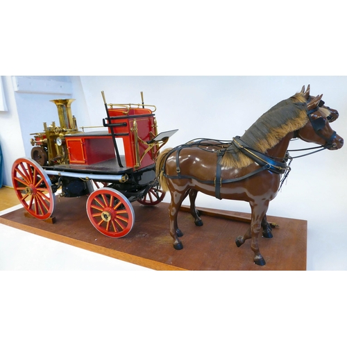 201 - A scratch built scale model, replica of a late 19thC two horse drawn fire engine with 'Metropolitan'... 