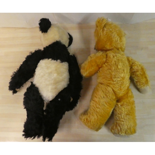 21 - A black and white mohair covered panda with a mobile head, limbs, a stitched nose and growler  ... 