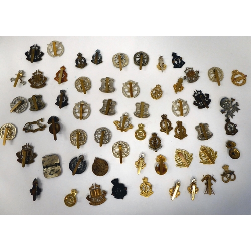 214 - Approximately fifty British military cap badges: to include Army Educational Corps; Glider Pilot Reg... 