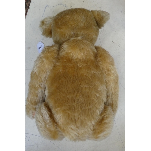 22 - A Steiff Classic 1906 mohair covered Teddy bear with a mobile head, limbs, a stitched nose and a gro... 