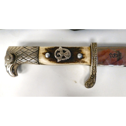 232 - A German Nazi Police bayonet with a white metal eagle's beak pommel and emblem on the rivetted, two-... 