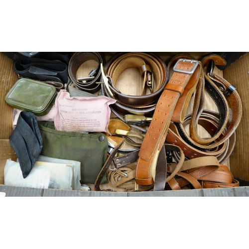 233 - A mixed lot: to include military and other belts and straps; two Russian military peaked caps; and B... 