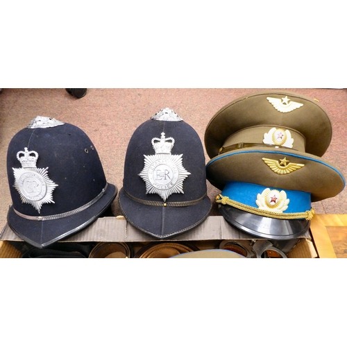 233 - A mixed lot: to include military and other belts and straps; two Russian military peaked caps; and B... 