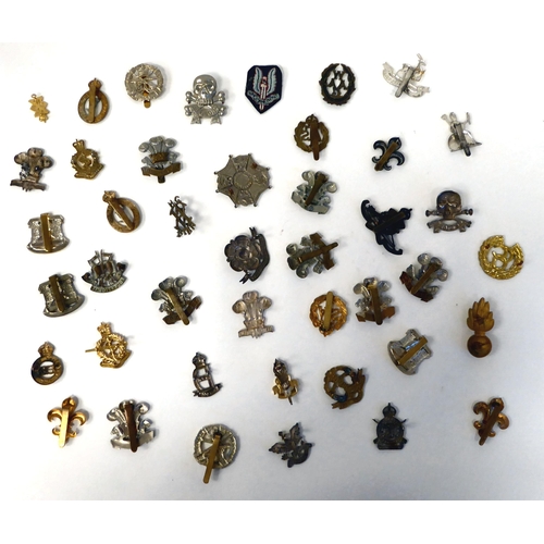 234 - Approximately thirty-five British military cap badges: to include County of London Yeomanry; Lancash... 