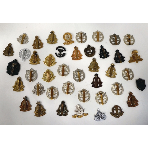 235 - Approximately thirty-five British military cap badges: to include Royal Army Ordnance Corps; Glider ... 