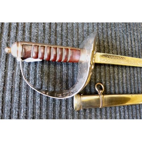 252 - An Edwardian VII dress sword with a pierced and silvered guard and a wire bound hide handgrip, the e... 