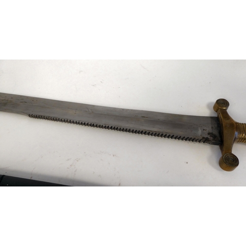 253 - A mid 19thC sawback sword with a ribbed brass, elliptical handgrip and crossguard, the blade 19