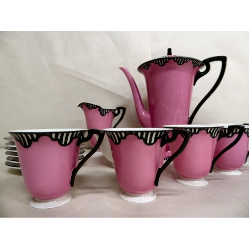 256 - A Royal Worcester china coffee set, decorated in pink with black stripes  bears a date cypher f... 