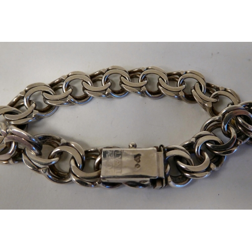 266 - A Swedish silver multi-ring link bracelet  bears the mark TAL A 09