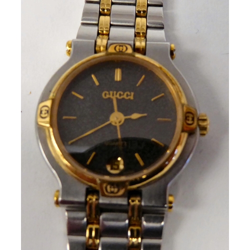 268 - A lady's Gucci bi-coloured stainless steel wristwatch, on a flexible strap, the quartz movement face... 