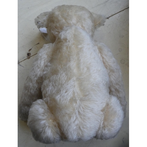 27 - A Steiff pale mohair covered Teddy bear with mobile limbs, a stitched nose and a growler  17