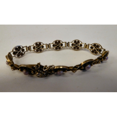 276 - A silver gilt and enamelled bead bracelet with uniform links  stamped 9305