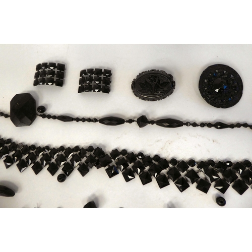 283 - Jet jewellery and various other black beads: to include brooches and buckles