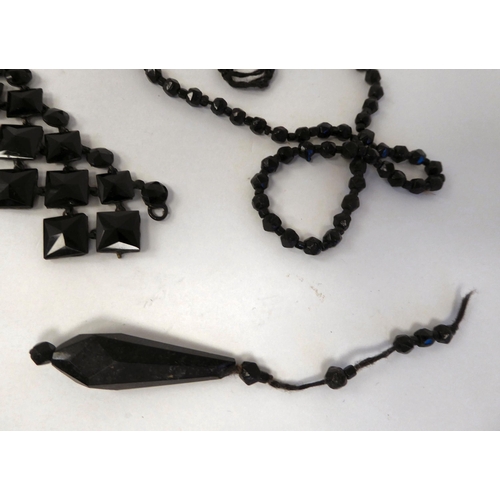 283 - Jet jewellery and various other black beads: to include brooches and buckles