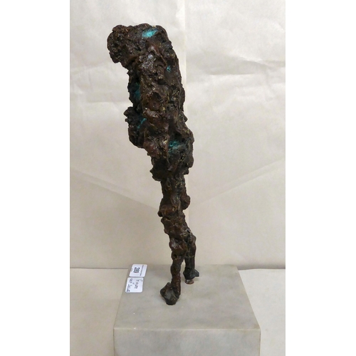 289 - A bronze abstract sculpture, a standing figure, on a marble plinth  17