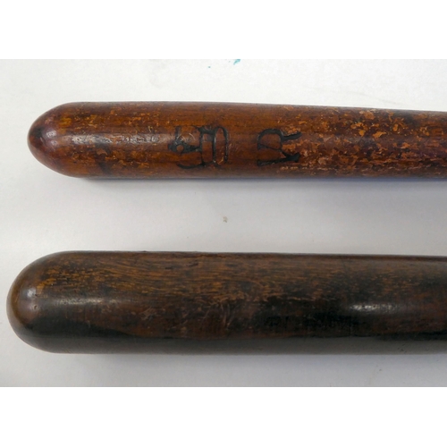 293 - A Victorian oak truncheon of tapered form with a ribbed, elliptical handgrip  17.5