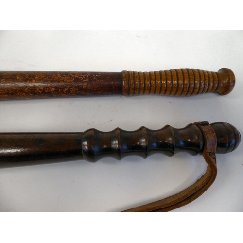 293 - A Victorian oak truncheon of tapered form with a ribbed, elliptical handgrip  17.5