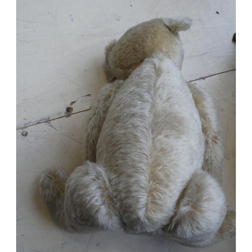 32 - A Steiff 1907 replica mohair covered Teddy bear with a mobile head, limbs and a stitched nose  ... 