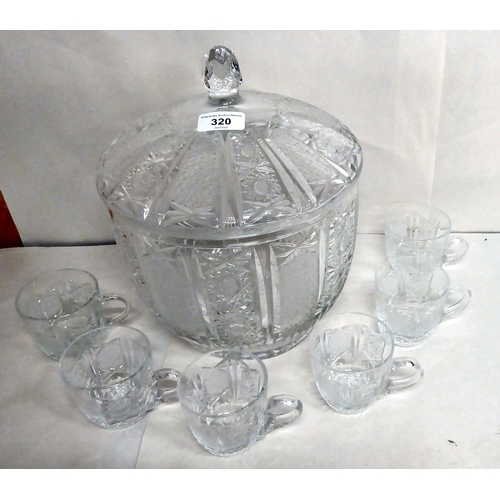 320 - A lead crystal punch bowl and cover with star cut panels  12