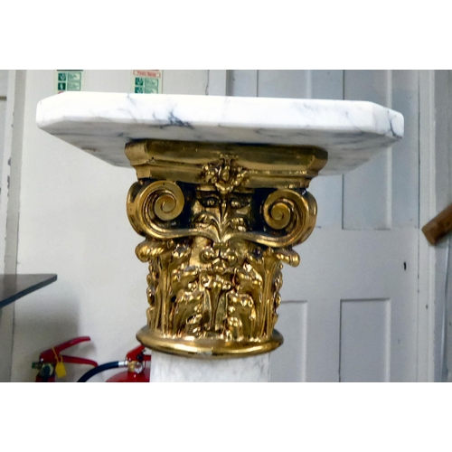 321 - A white and grey mottled marble column with a gilt composition Corinthian capital