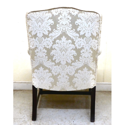 335 - A 20thC Gainsborough style mahogany showwood framed armchair, upholstered in cream coloured floral f... 