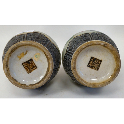 338 - A pair of 20thC Chinese porcelain vases of ovoid form, each with moulded flank handles, a narrow nec... 