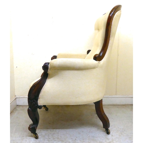 344 - A late Victorian carved mahogany showwood framed, waisted spoonback grandfather chair with enclosed ... 