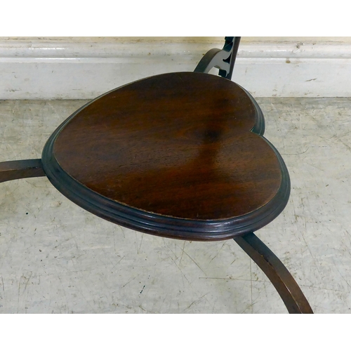 346 - An Edwardian mahogany heart shape occasional table, the top with a carved and shaped apron, raised o... 