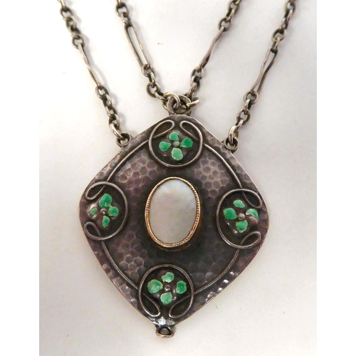 347 - An Arts & Crafts style Murrle Bennett hammered silver pendant, set with enamel and mother-of-pea... 