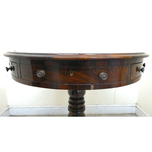 348 - A 19thC mahogany rotating, drum top table with a inset, tooled hide scriber, over three frieze drawe... 