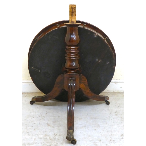 348 - A 19thC mahogany rotating, drum top table with a inset, tooled hide scriber, over three frieze drawe... 